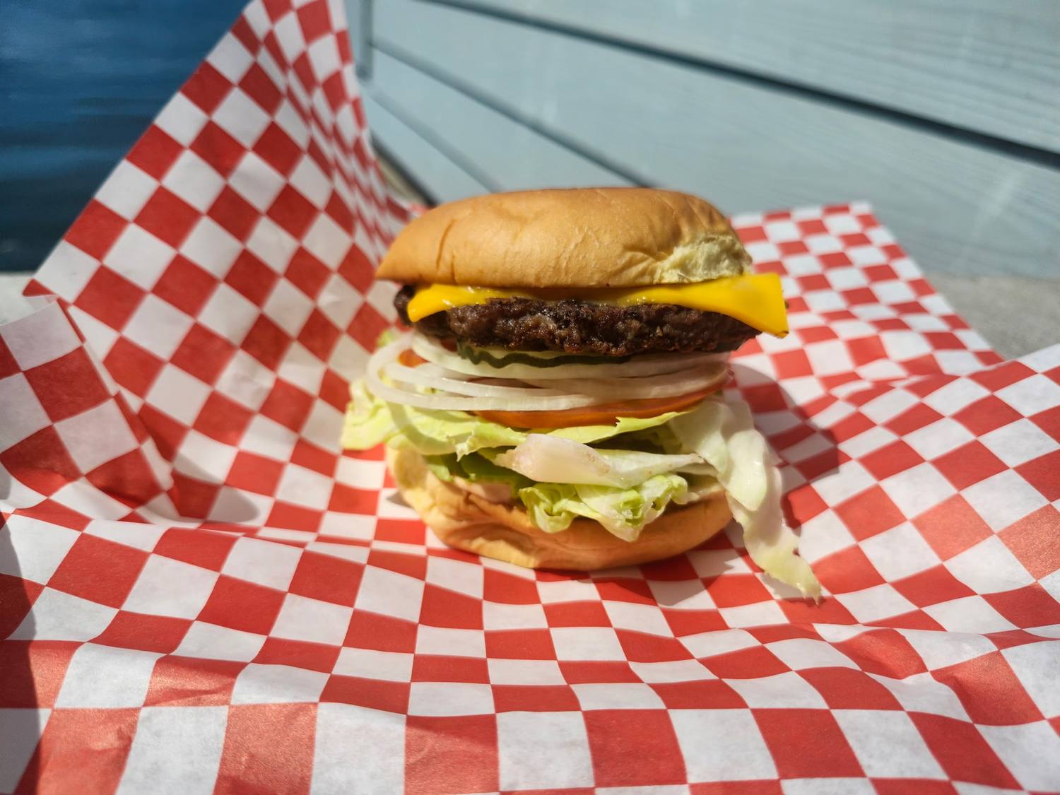 Cheeseburger with lettuce, tomato and American cheese