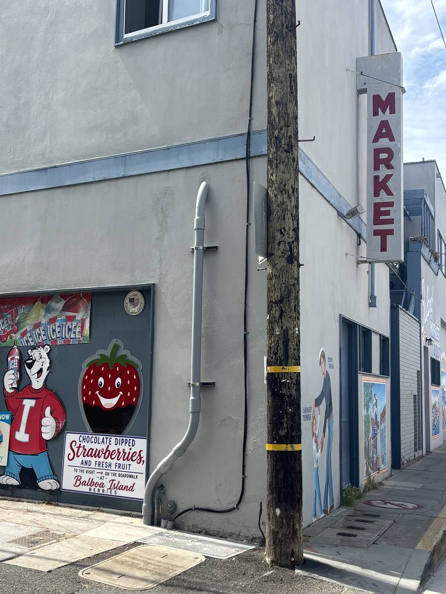 The MARKET blade sign on the side of the building